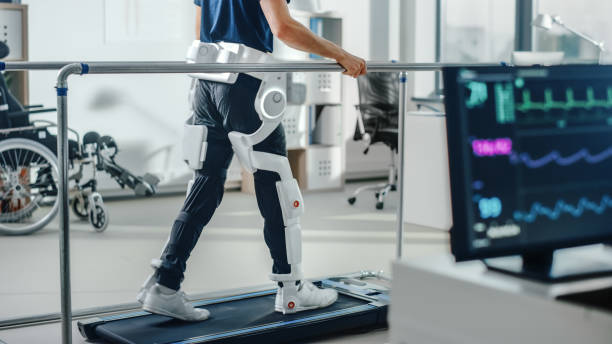 Person walking on treadmill with a robotic exoskeleton for their legs