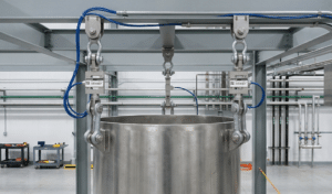 Tension load cells suspending industrial hopper for batching system with multiple load points